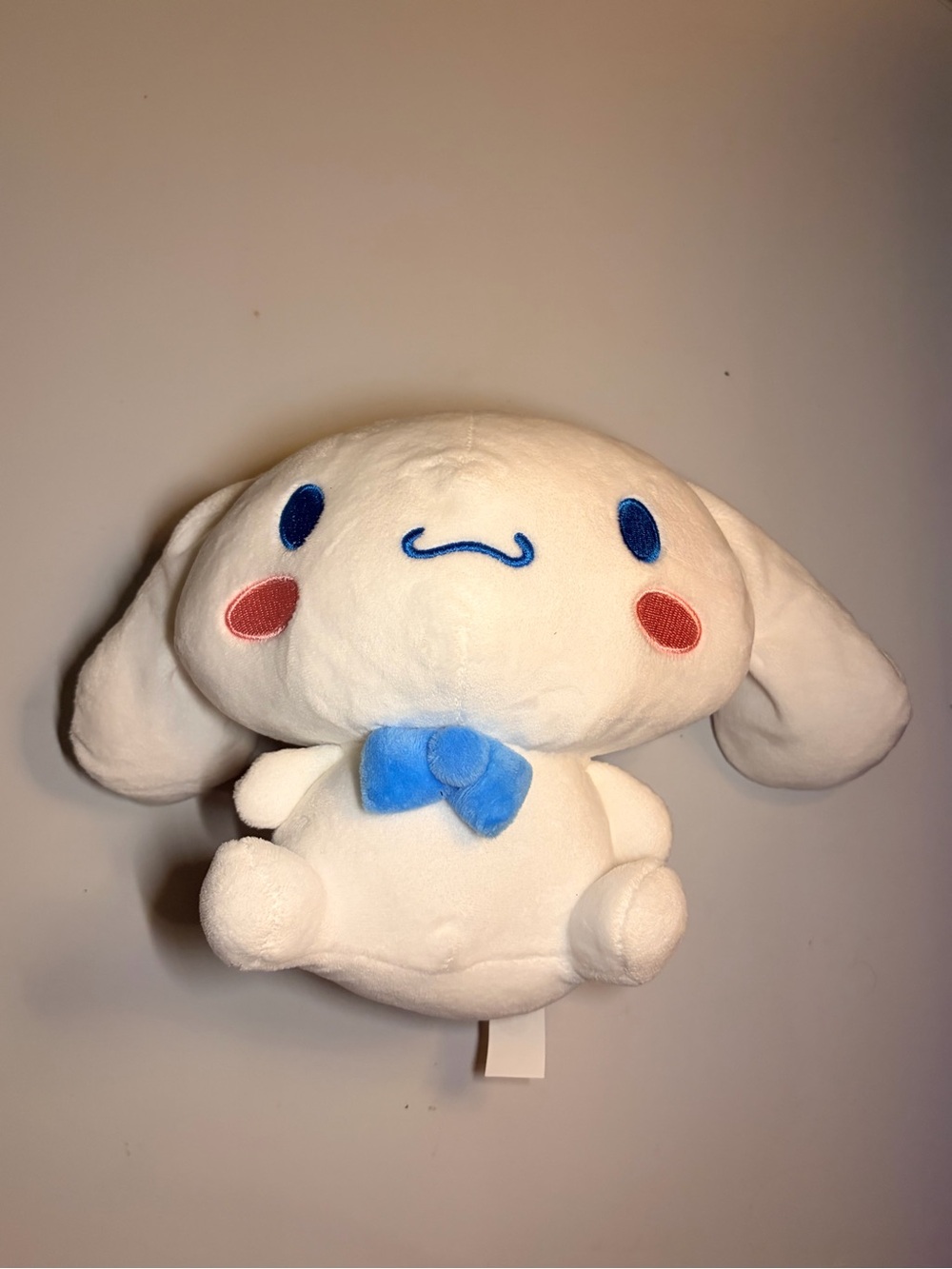 Sanrio White Cinnamoroll Plush with Blue Bow and Pink Cheeks